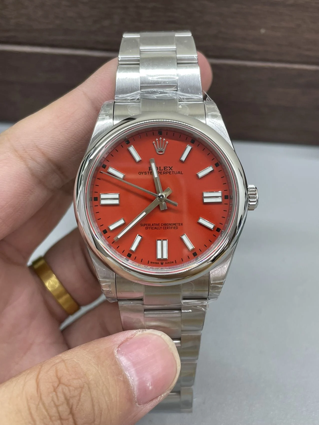 Rolex Oyster Perpetual Red Dial 41mm — photographed off the sweep