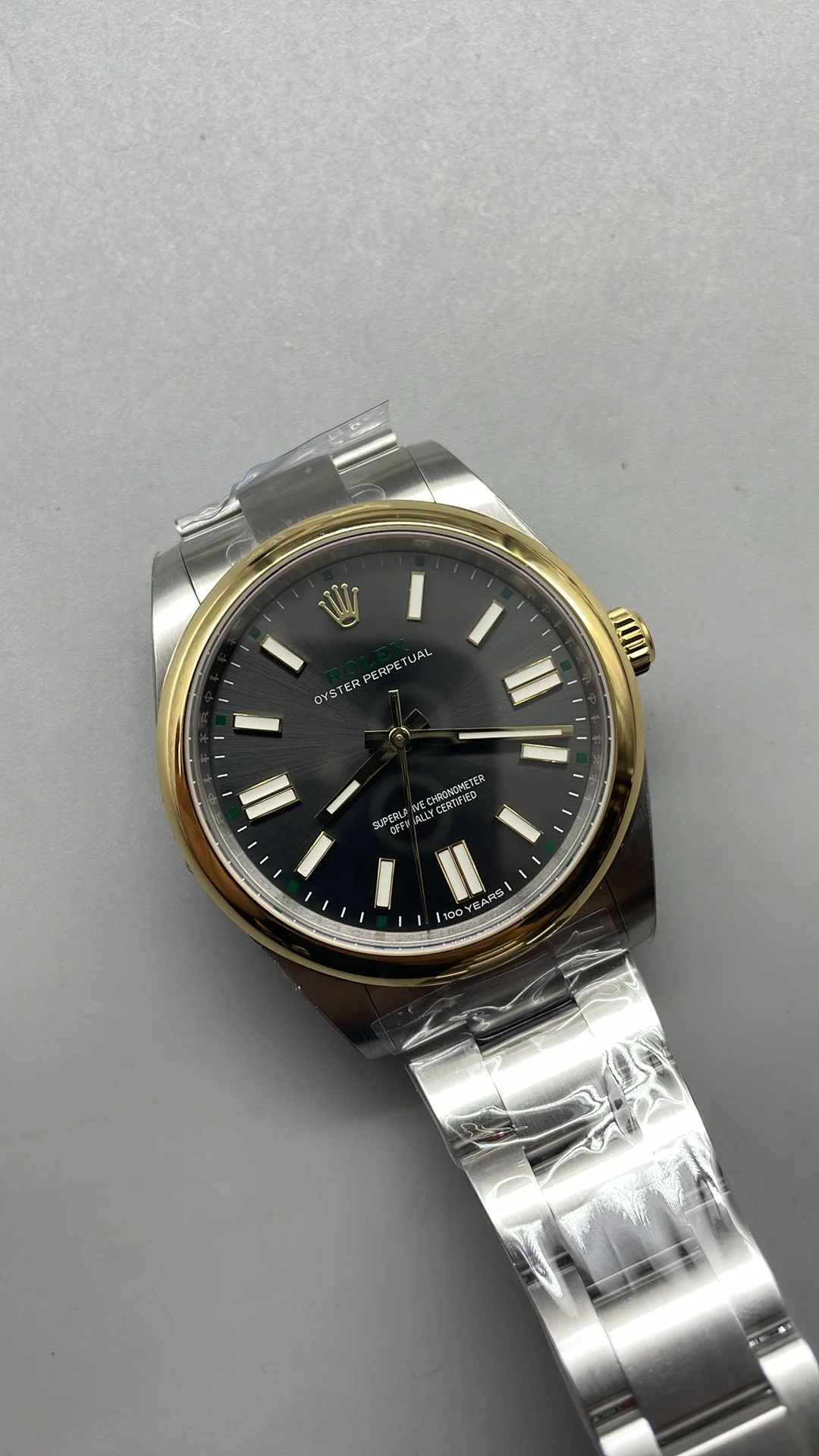 Rolex Oyster Perpetual Two-Tone Grey Dial 41mm — photographed off the sweep