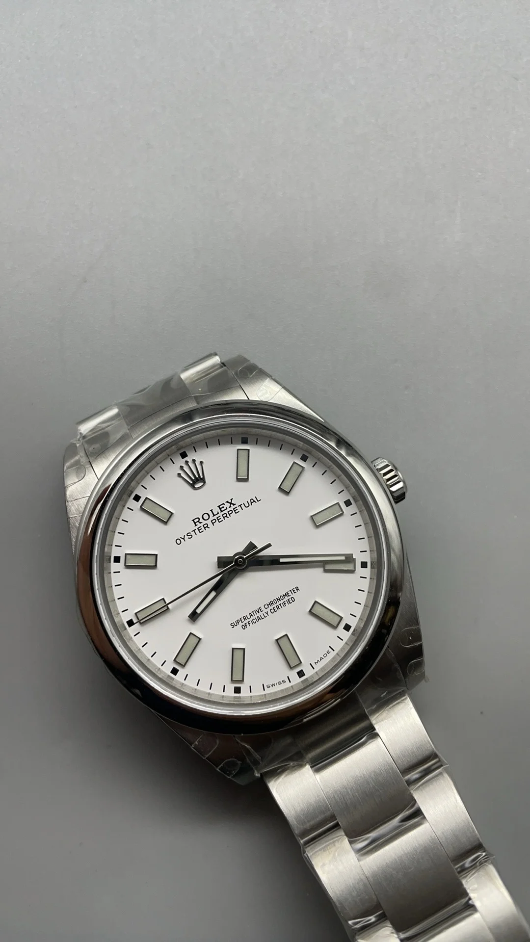 Rolex Oyster Perpetual White Dial 39mm — photographed off the sweep