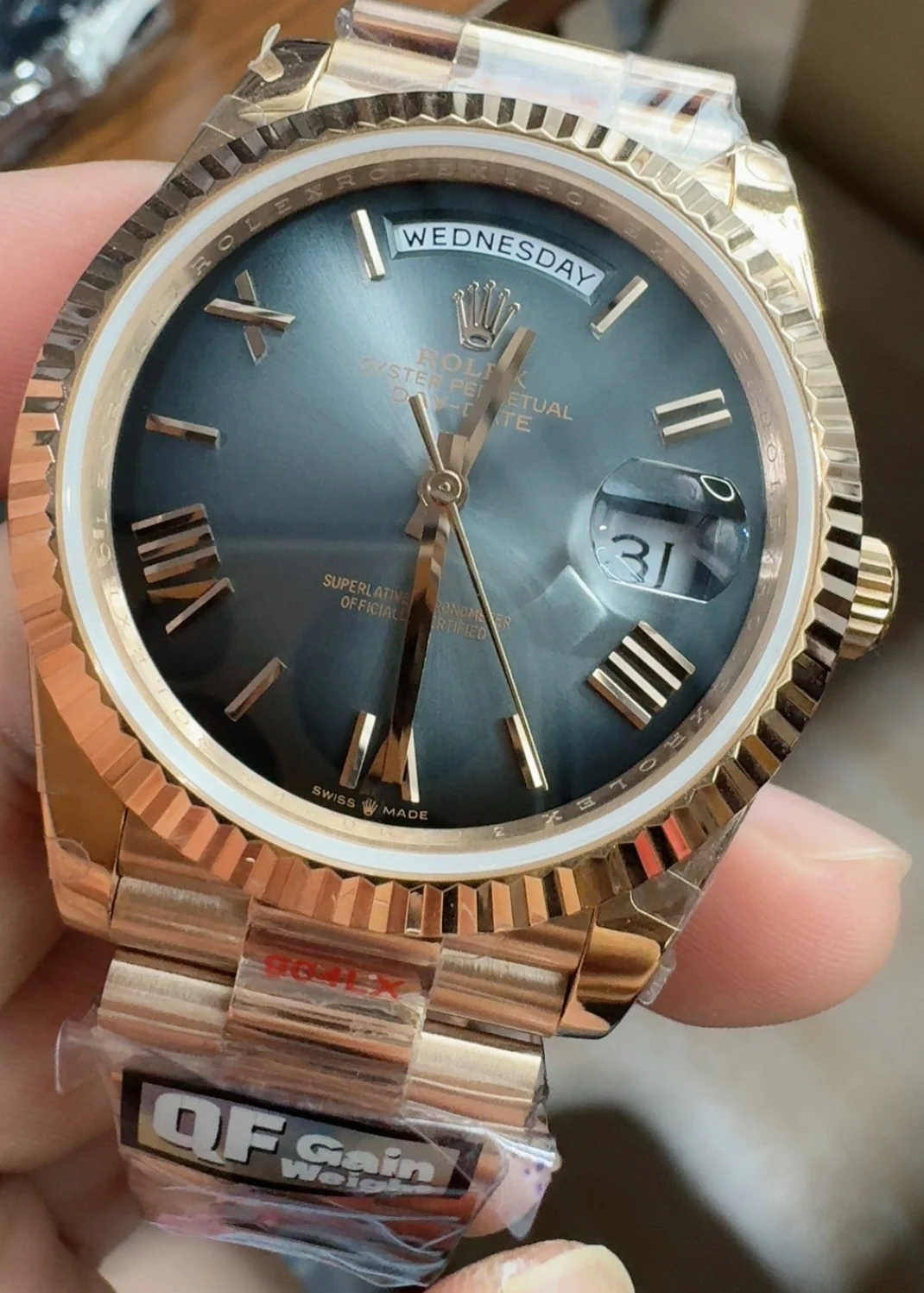 Rolex Rose Gold Black Dial 40mm — photographed off the sweep
