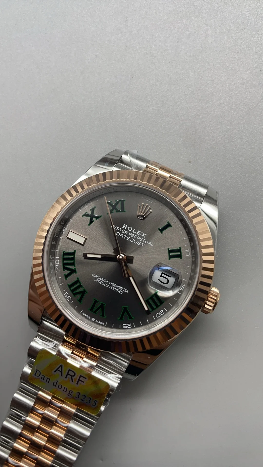 Rolex Rose Gold Green Dial — photographed off the sweep