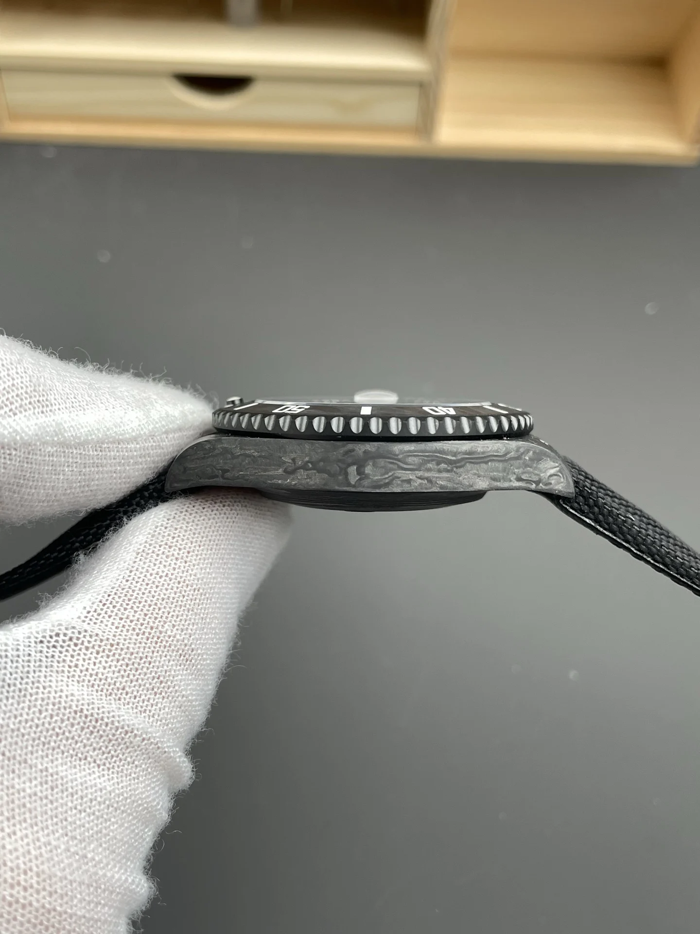 Rolex Submariner Carbon Black Dial 40mm — photographed off the sweep