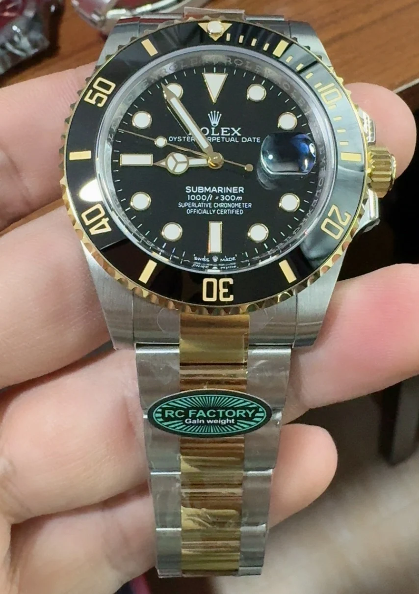 Rolex Submariner Two-Tone Black Dial 41mm — photographed off the sweep