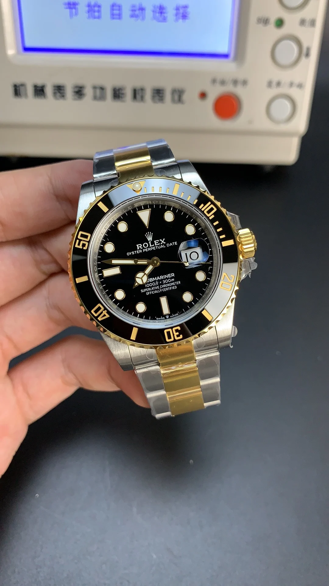 Rolex Submariner Two-Tone Black Dial 41mm — photographed off the sweep