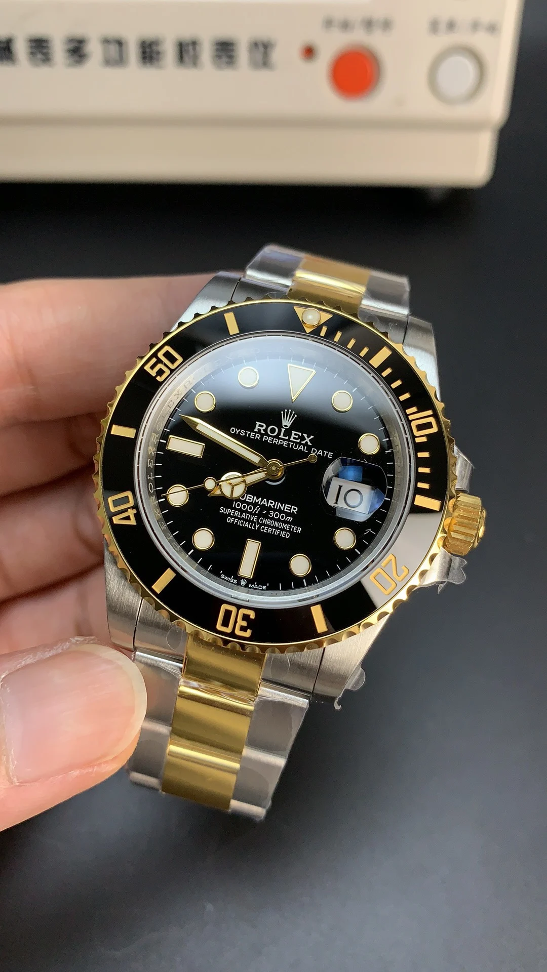 Rolex Submariner Two-Tone Black Dial 41mm — photographed off the sweep