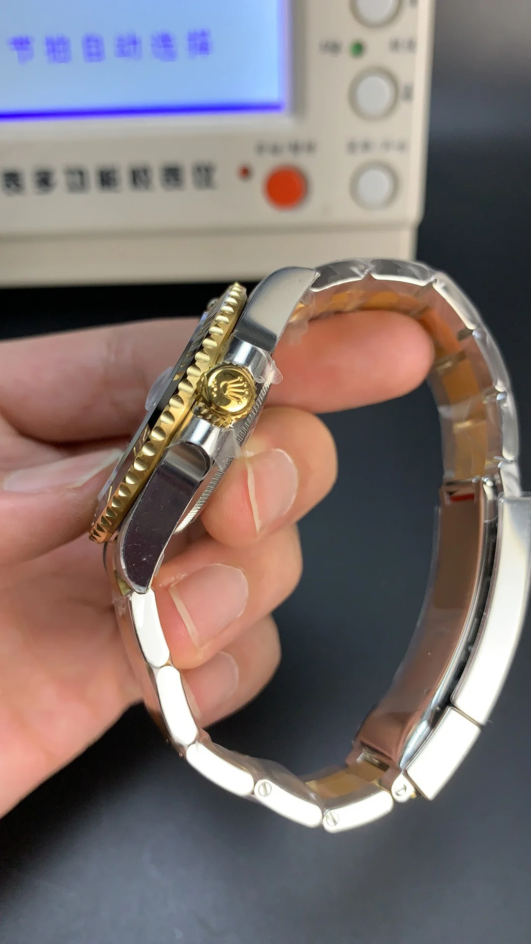 Rolex Submariner Two-Tone Black Dial 41mm — photographed off the sweep