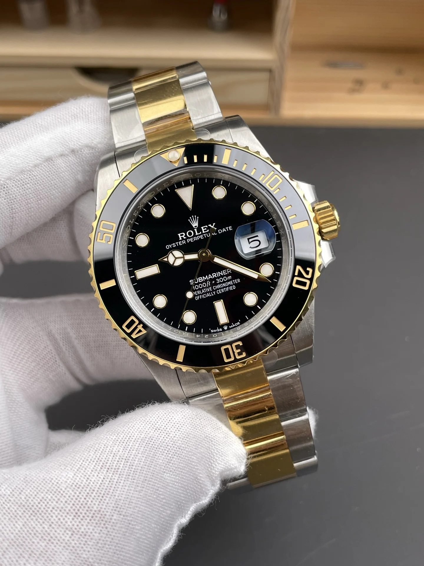 Rolex Submariner Two-Tone Black Dial 41mm — photographed off the sweep