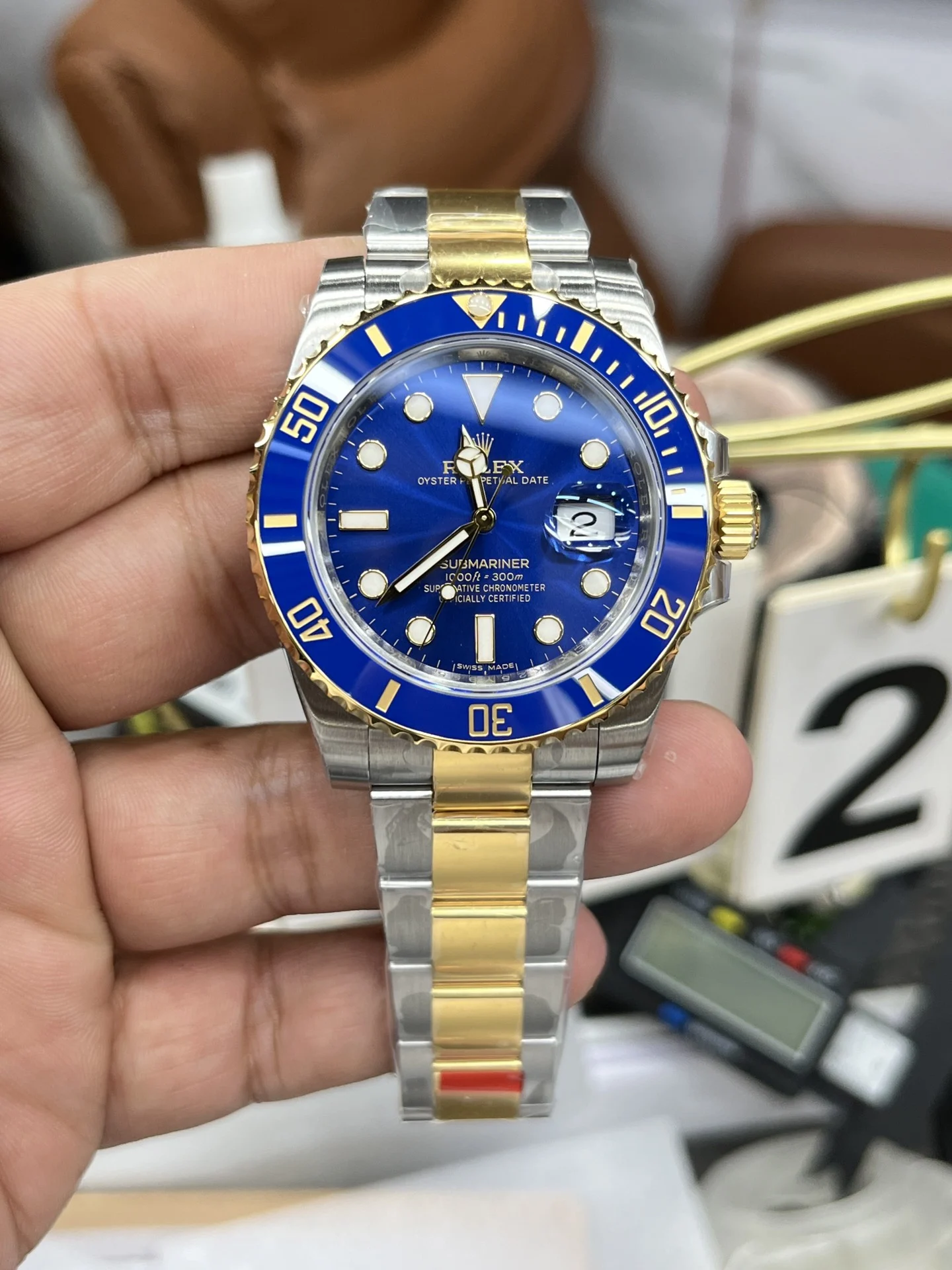 Rolex Submariner Two-Tone Blue Dial 40mm — photographed off the sweep