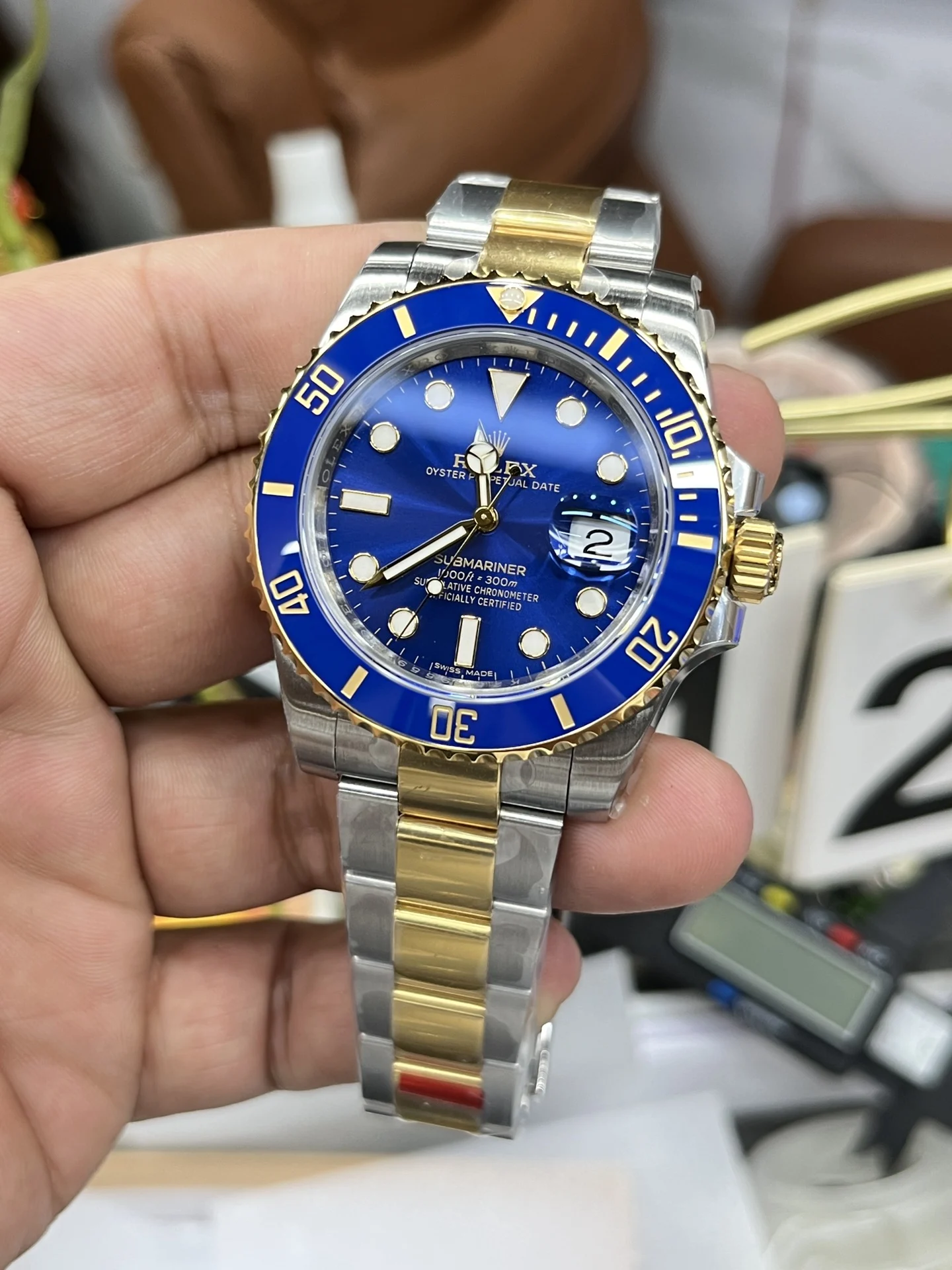 Rolex Submariner Two-Tone Blue Dial 40mm — photographed off the sweep