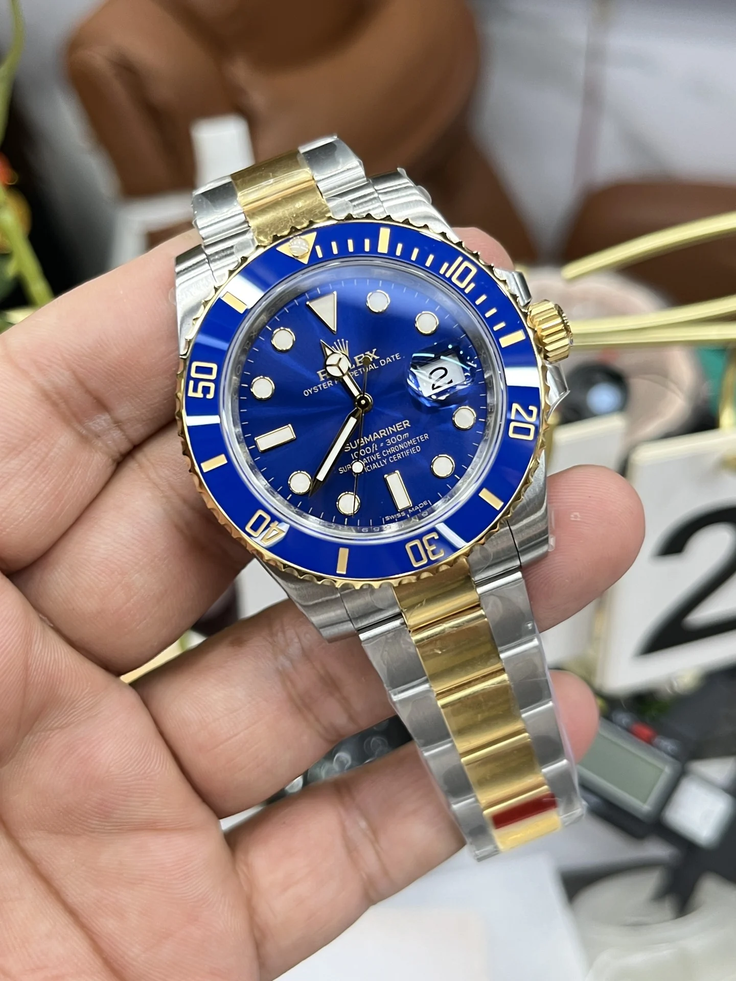 Rolex Submariner Two-Tone Blue Dial 40mm — photographed off the sweep