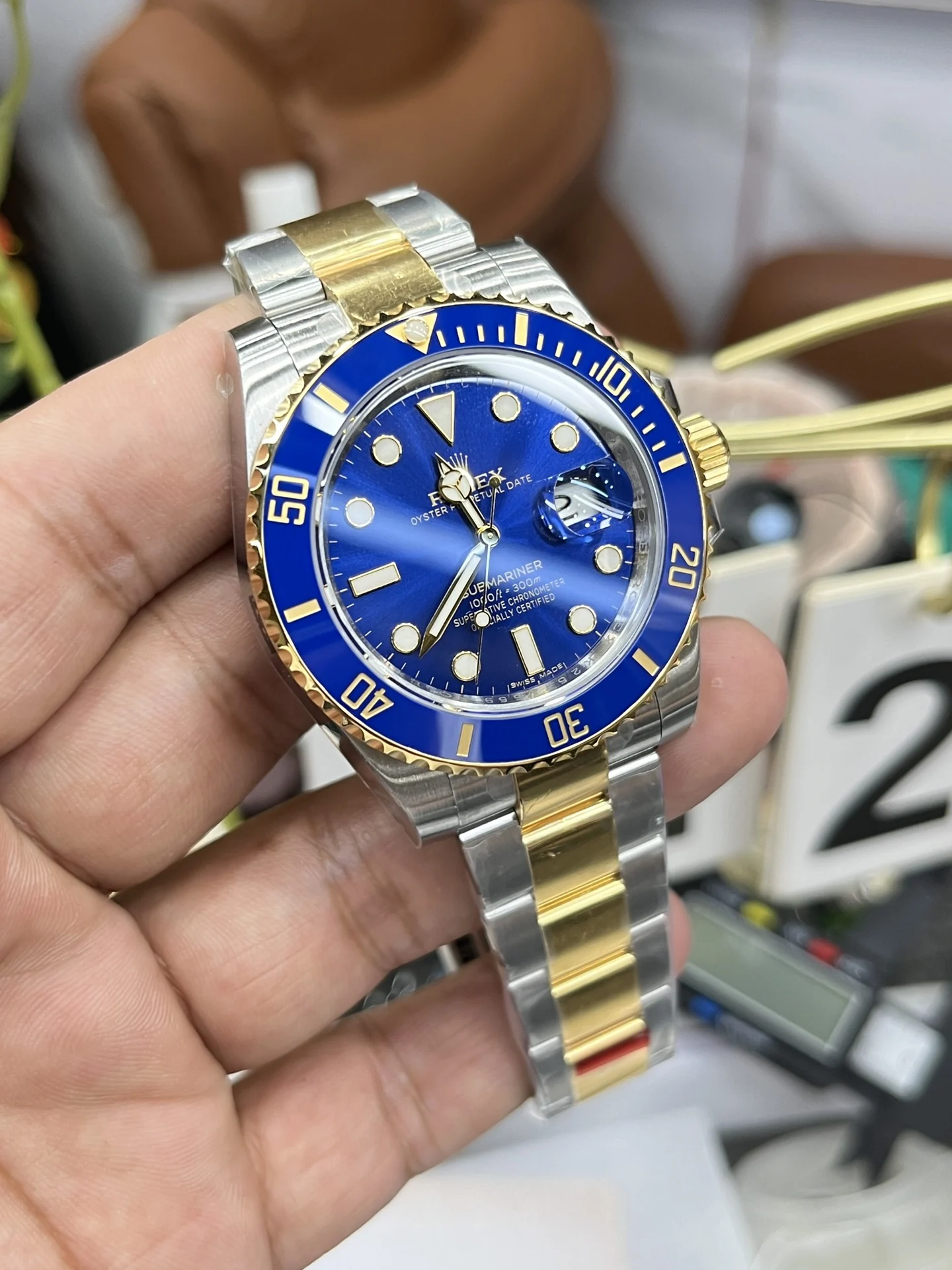 Rolex Submariner Two-Tone Blue Dial 40mm — photographed off the sweep