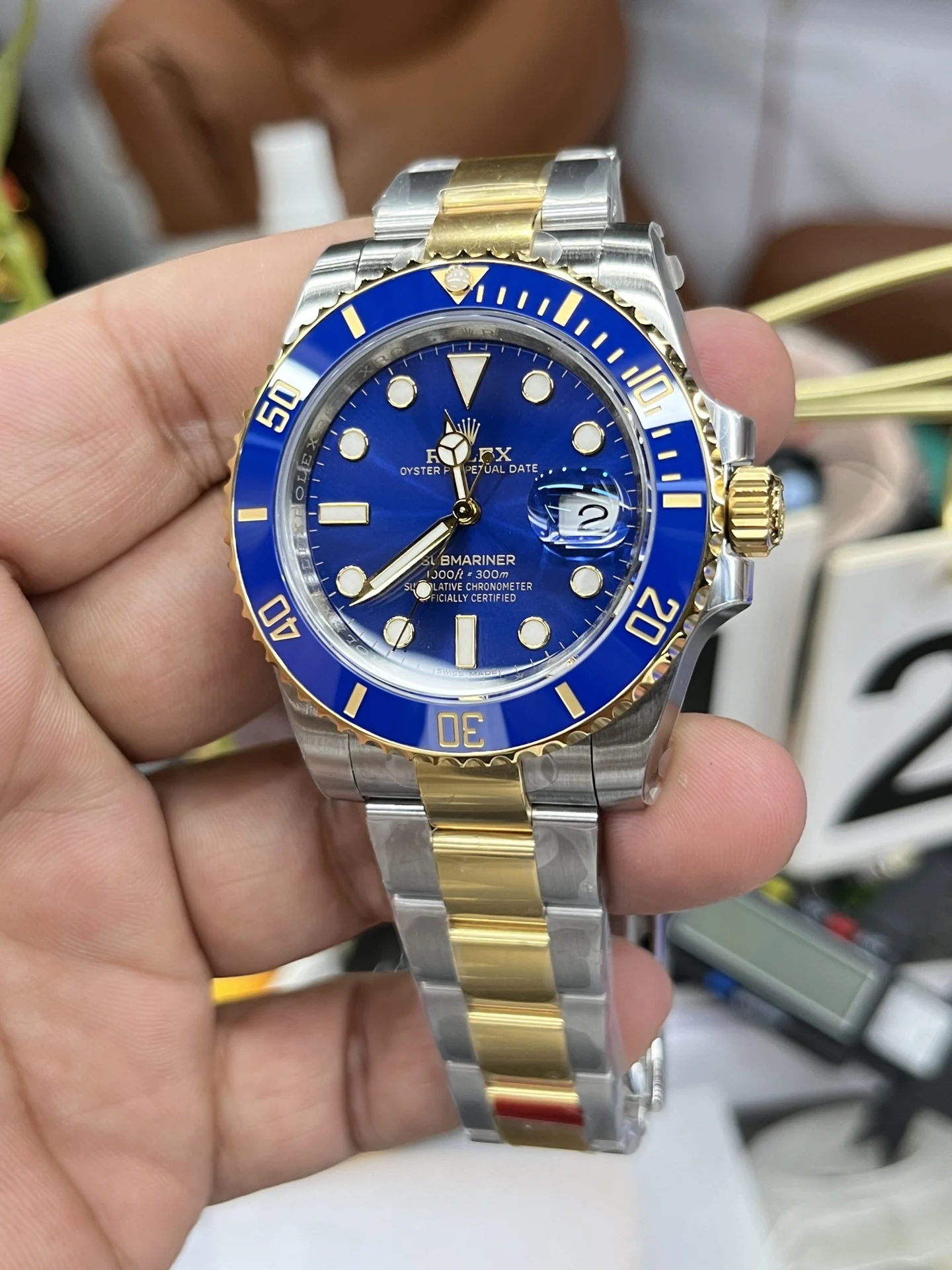 Rolex Submariner Two-Tone Blue Dial 40mm — photographed off the sweep