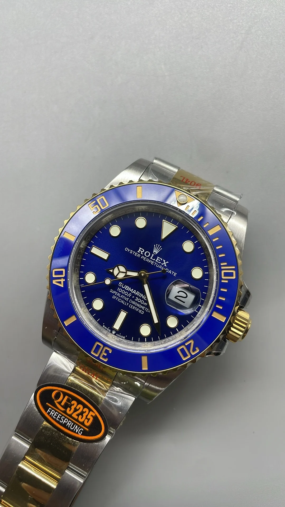 Rolex Submariner Two-Tone Blue Dial 41mm — photographed off the sweep