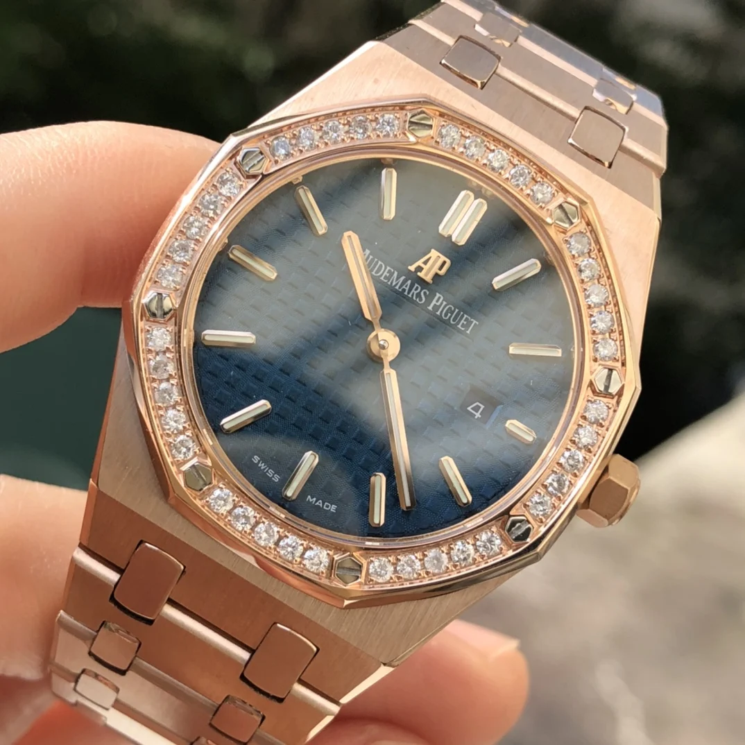 Rose gold, dark blue dial — photographed off the sweep