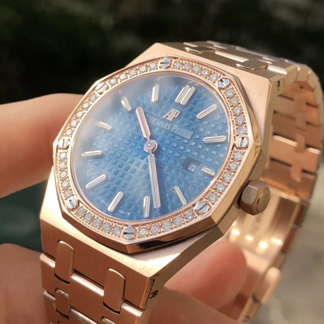 Rose gold, dark blue dial — photographed off the sweep