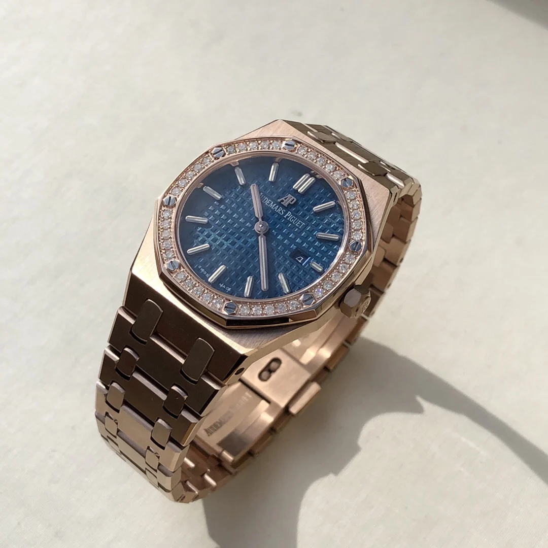 Rose gold, dark blue dial — photographed off the sweep