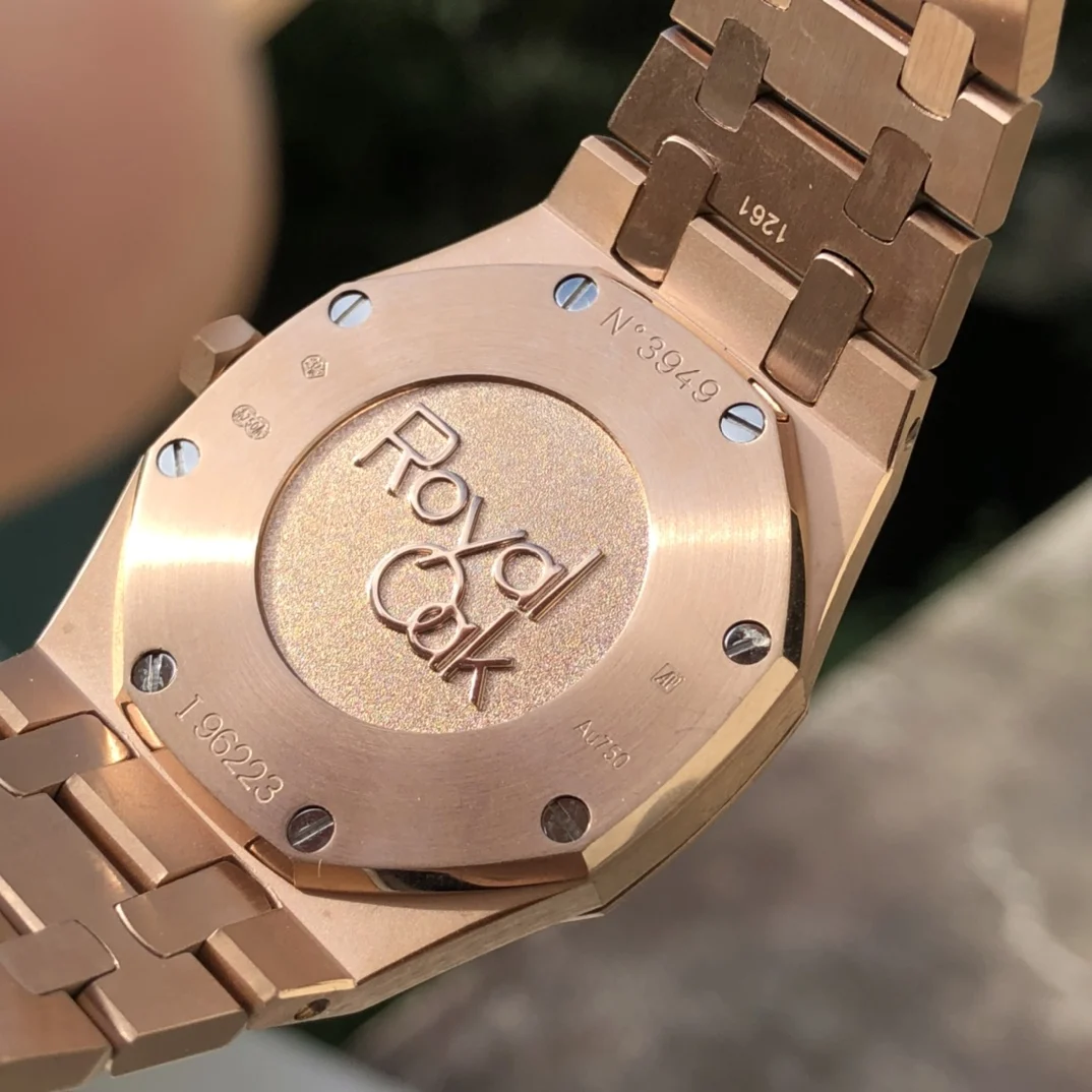 Rose gold, dark blue dial — photographed off the sweep