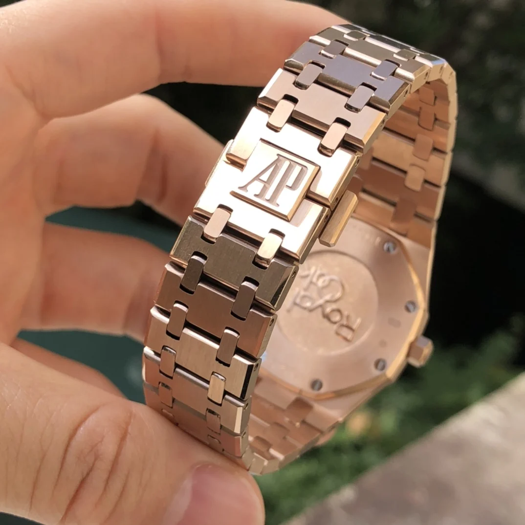 Rose gold, dark blue dial — photographed off the sweep