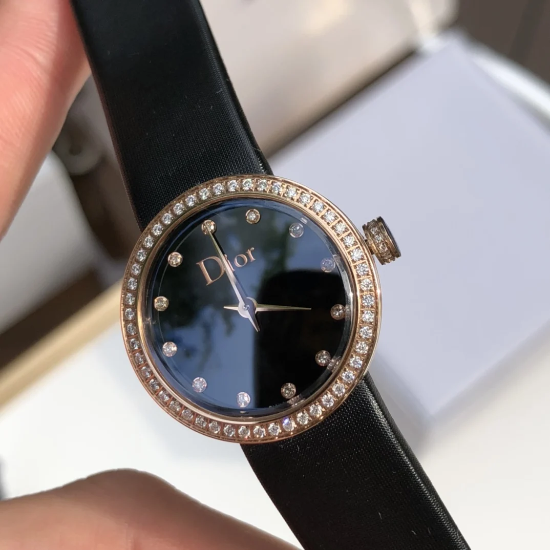 Stainless steel case, 25mm diameter gold bezel and crown set
