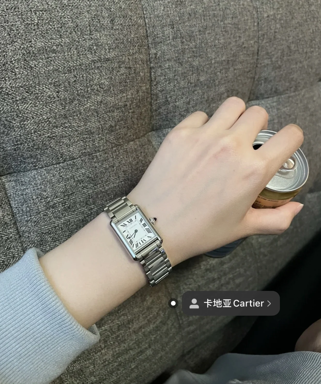 Steel bracelet on the wrist — photographed off the sweep