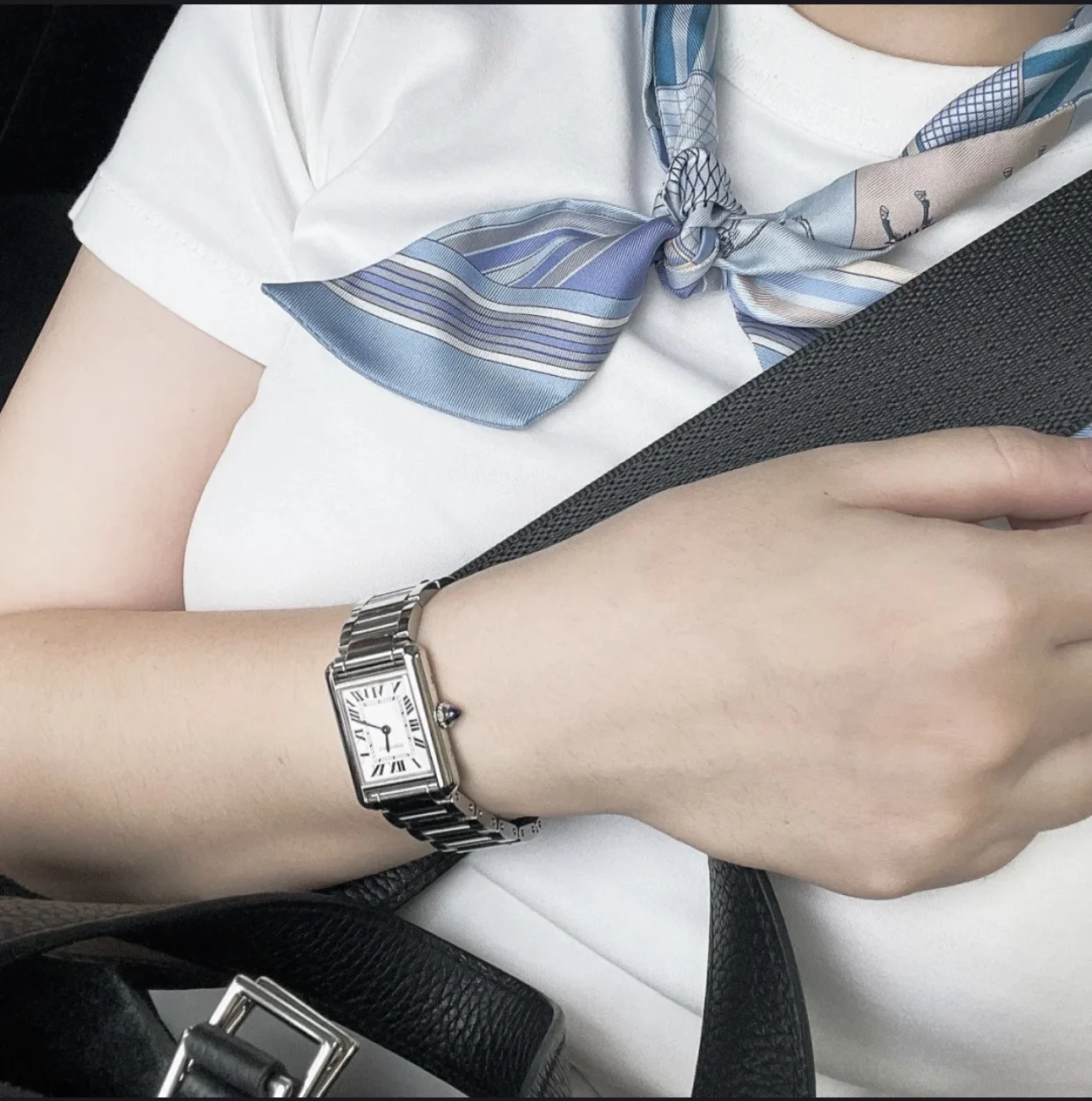 Steel bracelet on the wrist — photographed off the sweep
