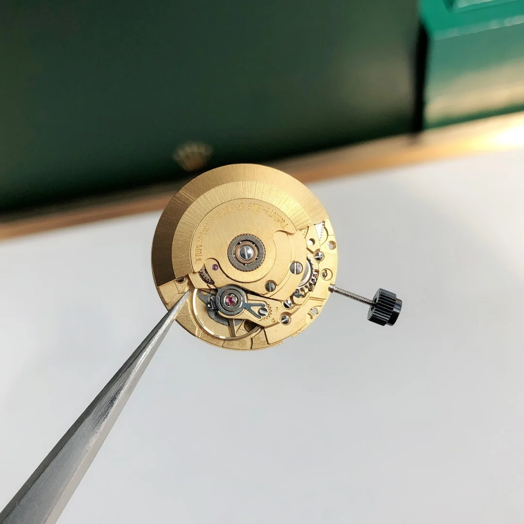 Swiss ETA 2836 gold fitting machine — photographed off the sweep
