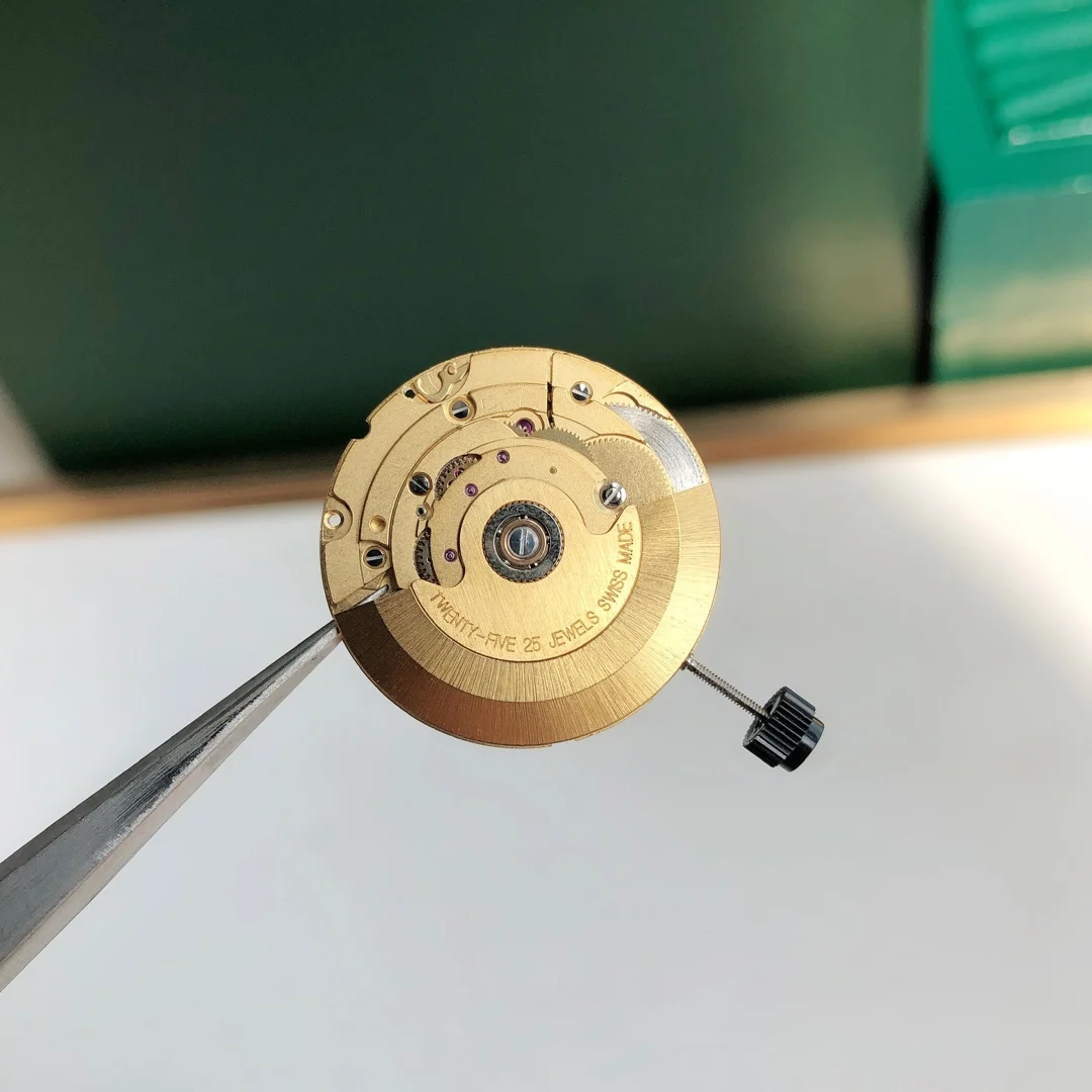 Swiss ETA 2836 gold fitting machine — photographed off the sweep