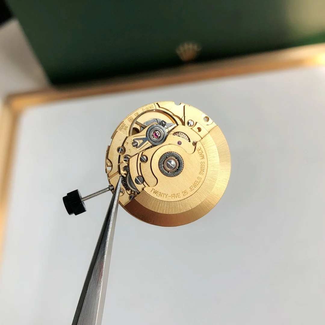 Swiss ETA 2836 gold fitting machine — photographed off the sweep