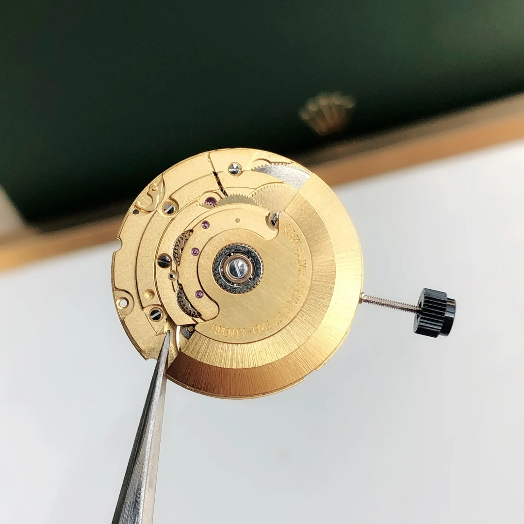 Swiss ETA 2836 gold fitting machine — photographed off the sweep