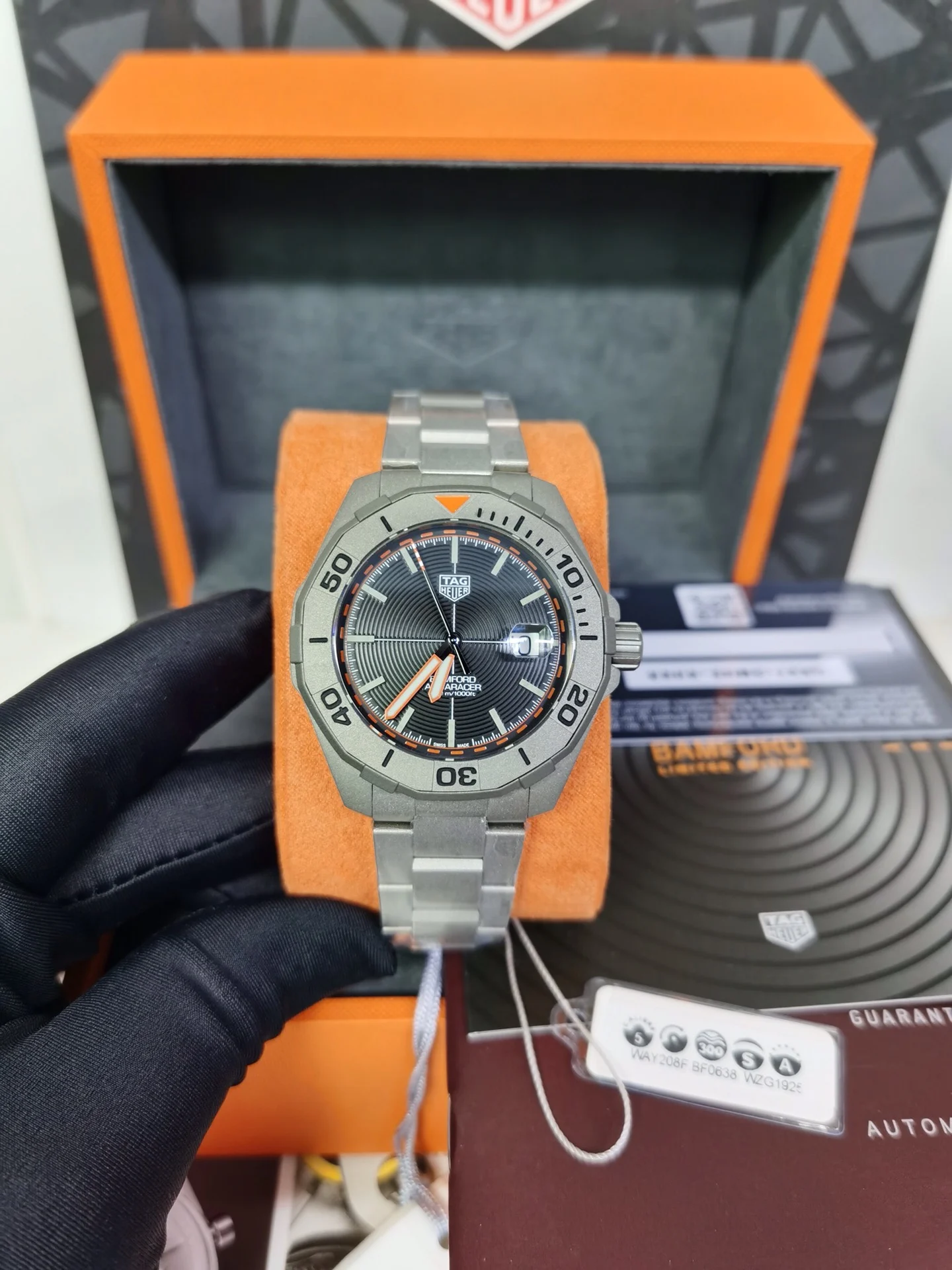 TAG Heuer Aquaracer Titanium Orange Dial 43mm — photographed off the sweep