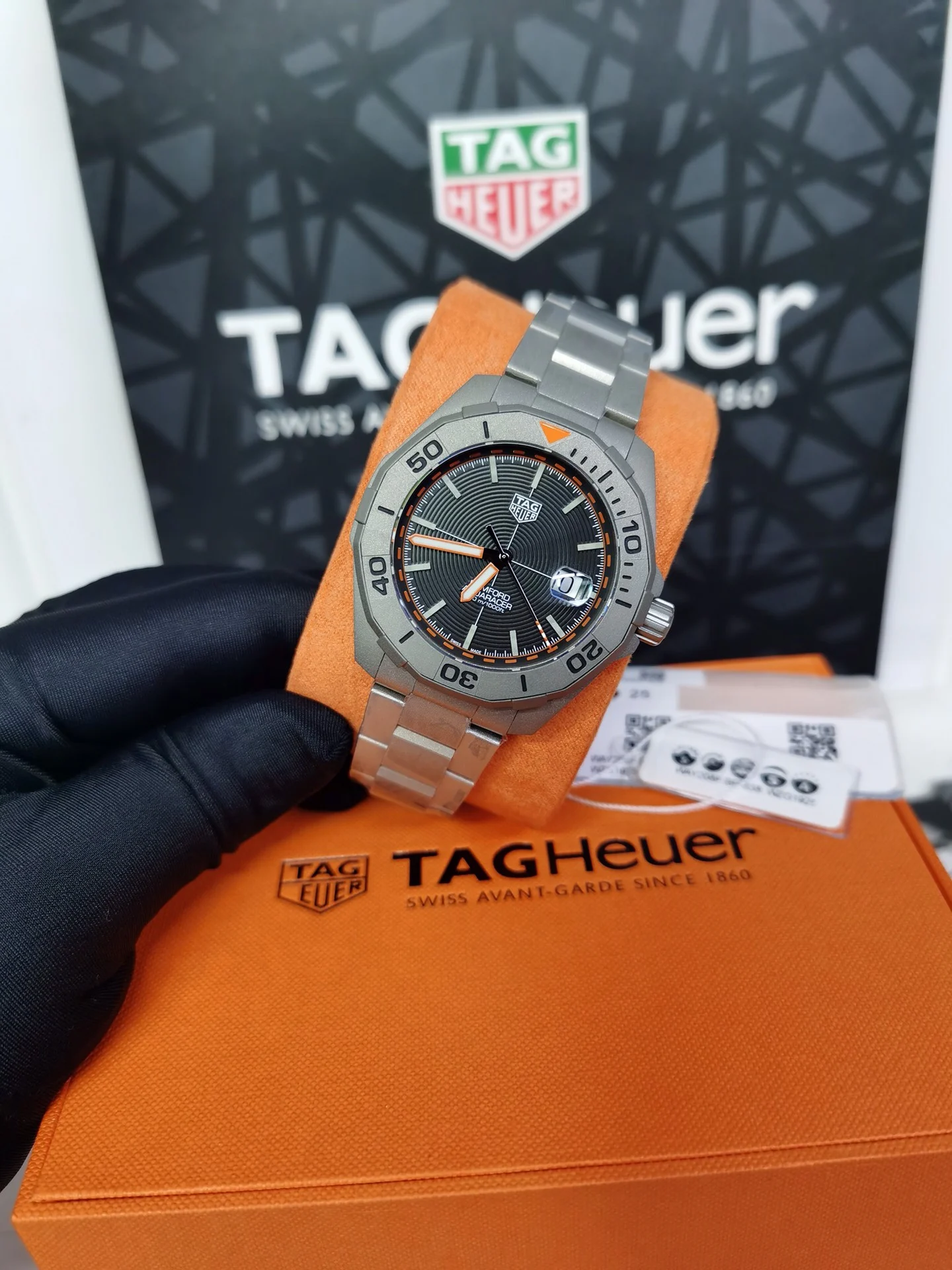 TAG Heuer Aquaracer Titanium Orange Dial 43mm — photographed off the sweep