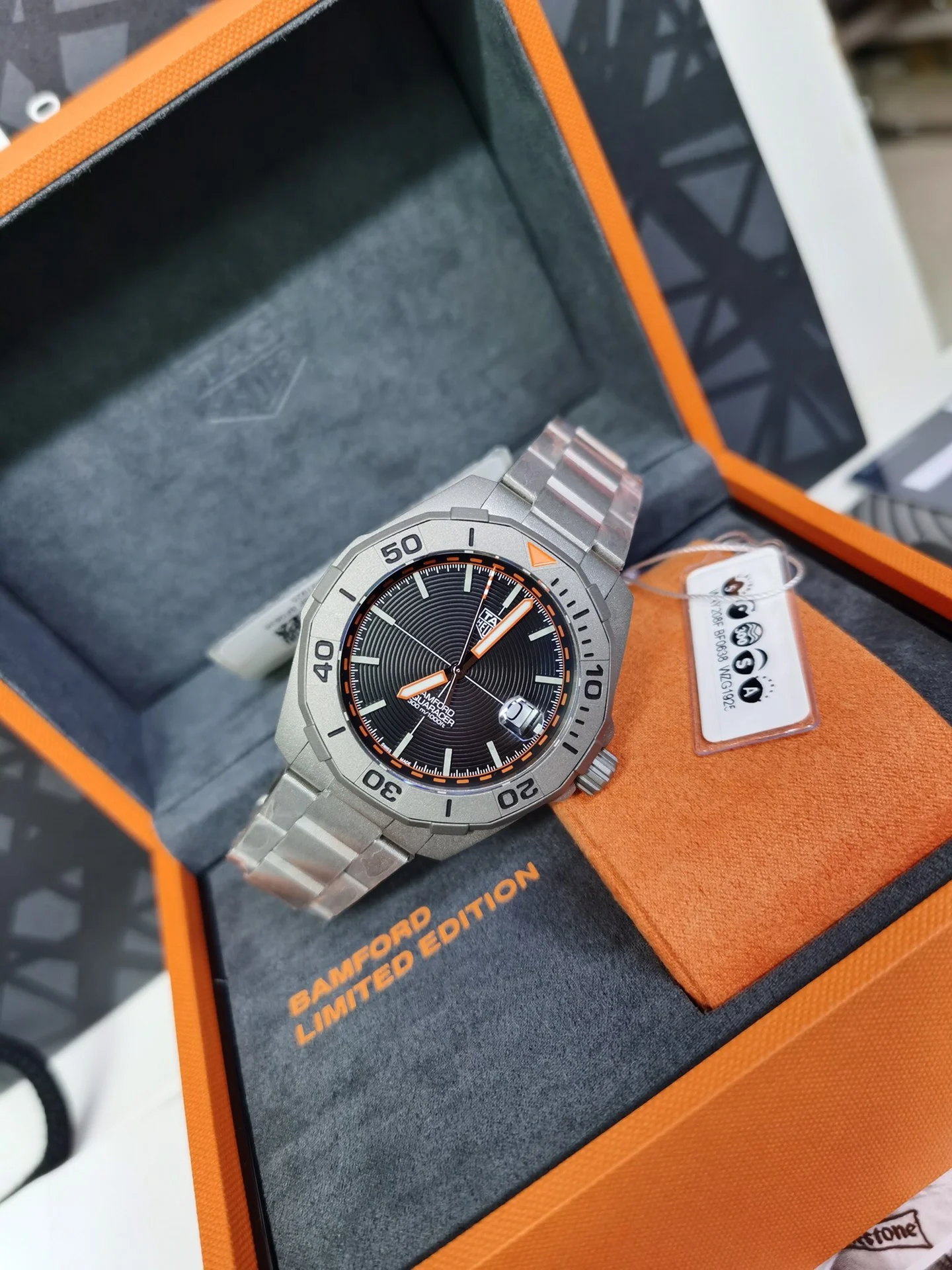 TAG Heuer Aquaracer Titanium Orange Dial 43mm — photographed off the sweep