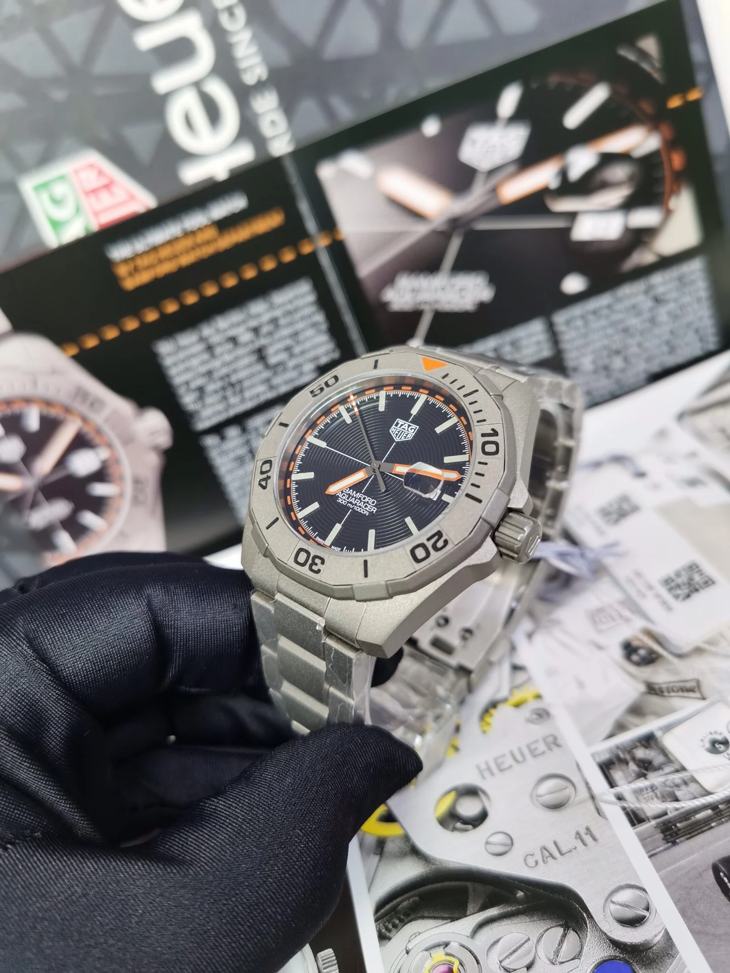 TAG Heuer Aquaracer Titanium Orange Dial 43mm — photographed off the sweep