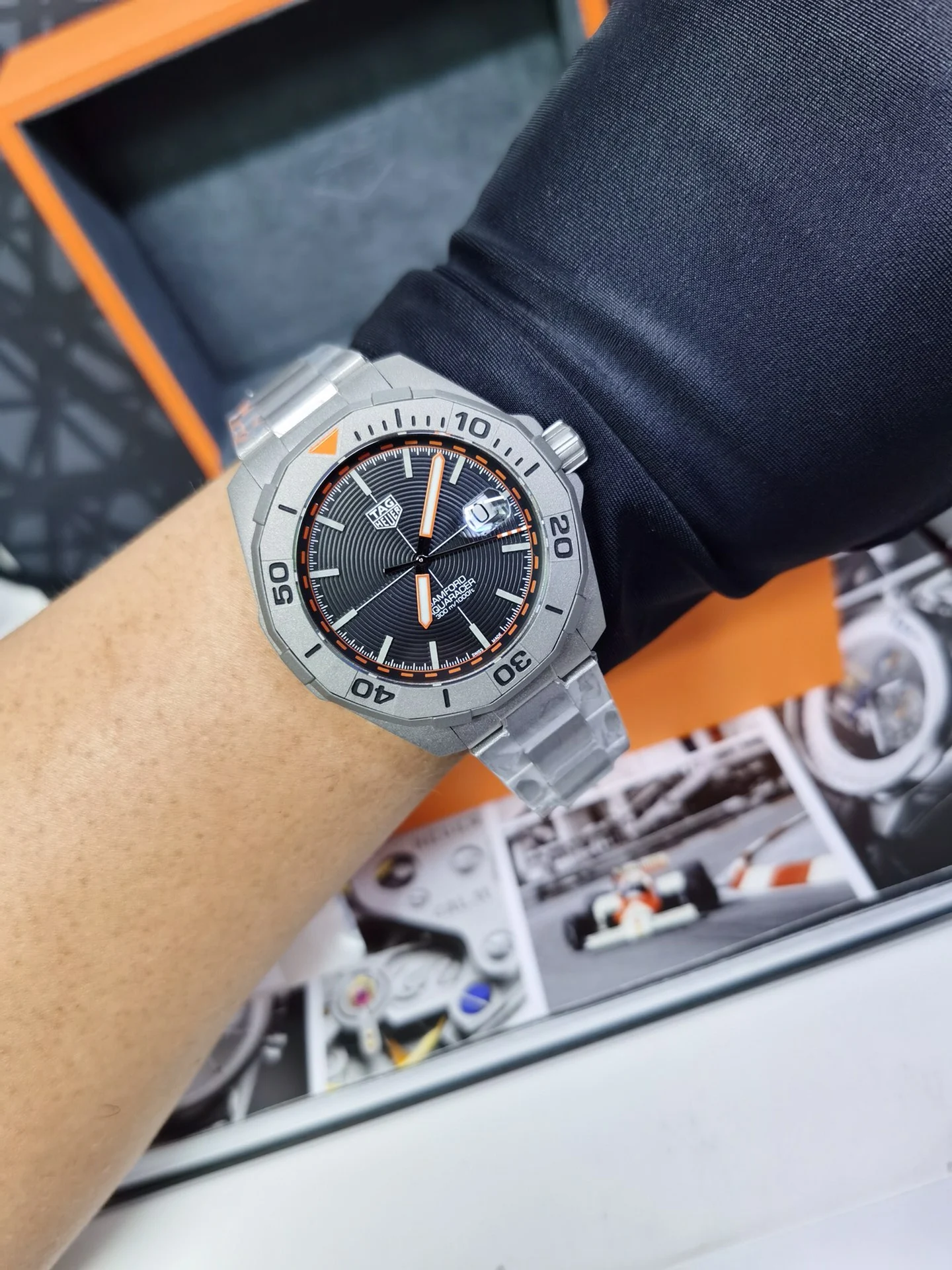 TAG Heuer Aquaracer Titanium Orange Dial 43mm — photographed off the sweep