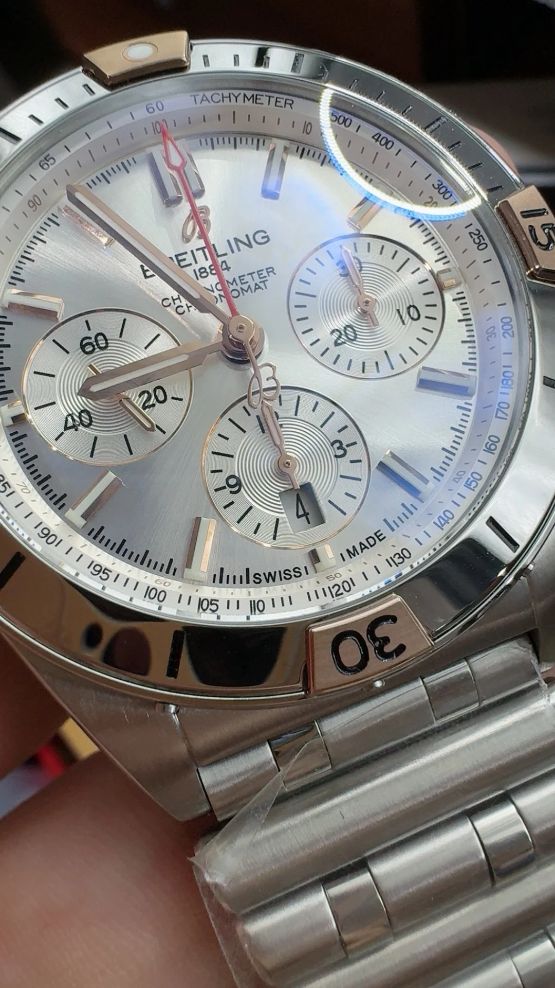 Tf, two-tone steel and rose gold bullet-link bracelet — photographed off the sweep