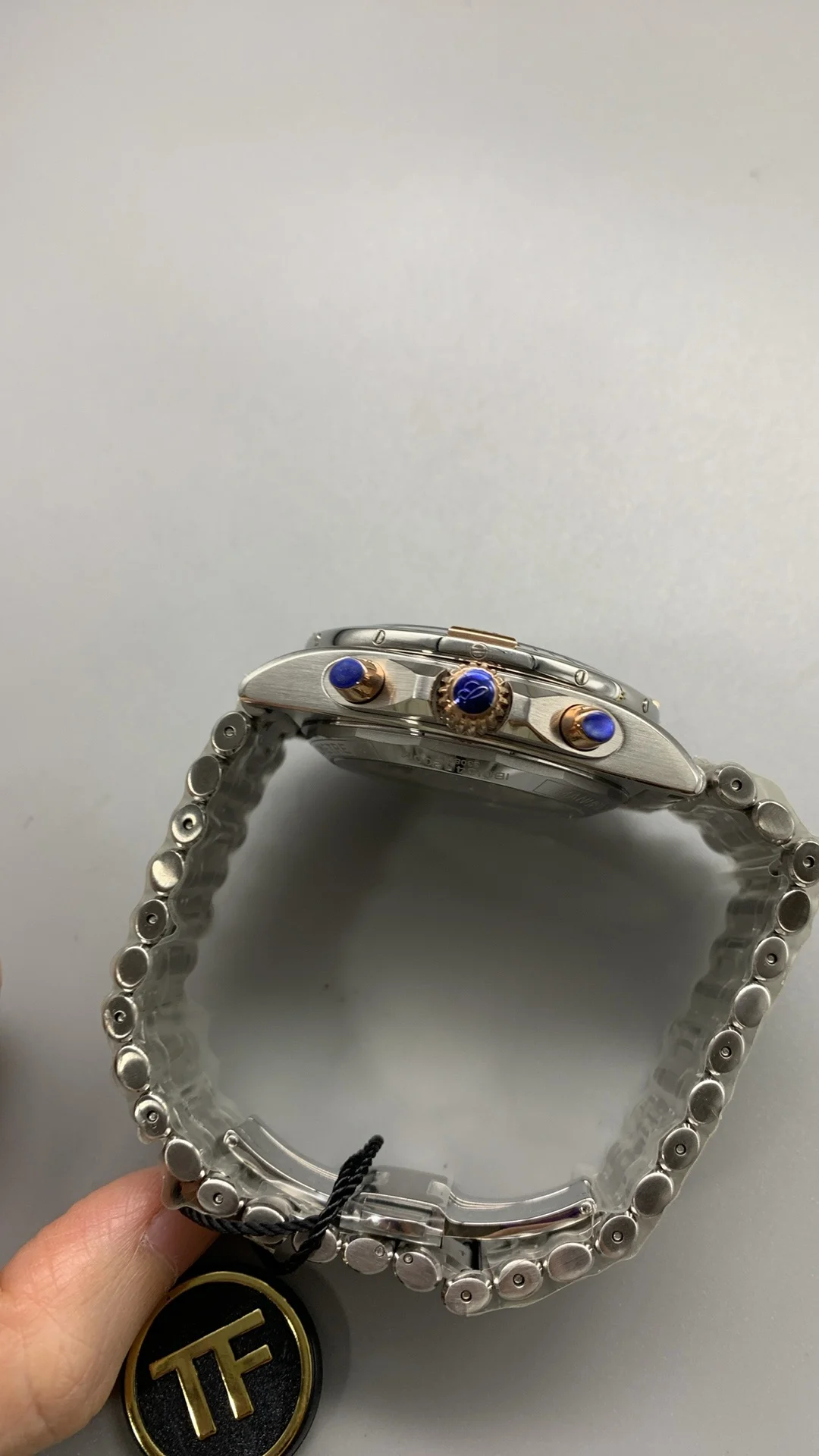 Tf, two-tone steel and rose gold bullet-link bracelet — photographed off the sweep
