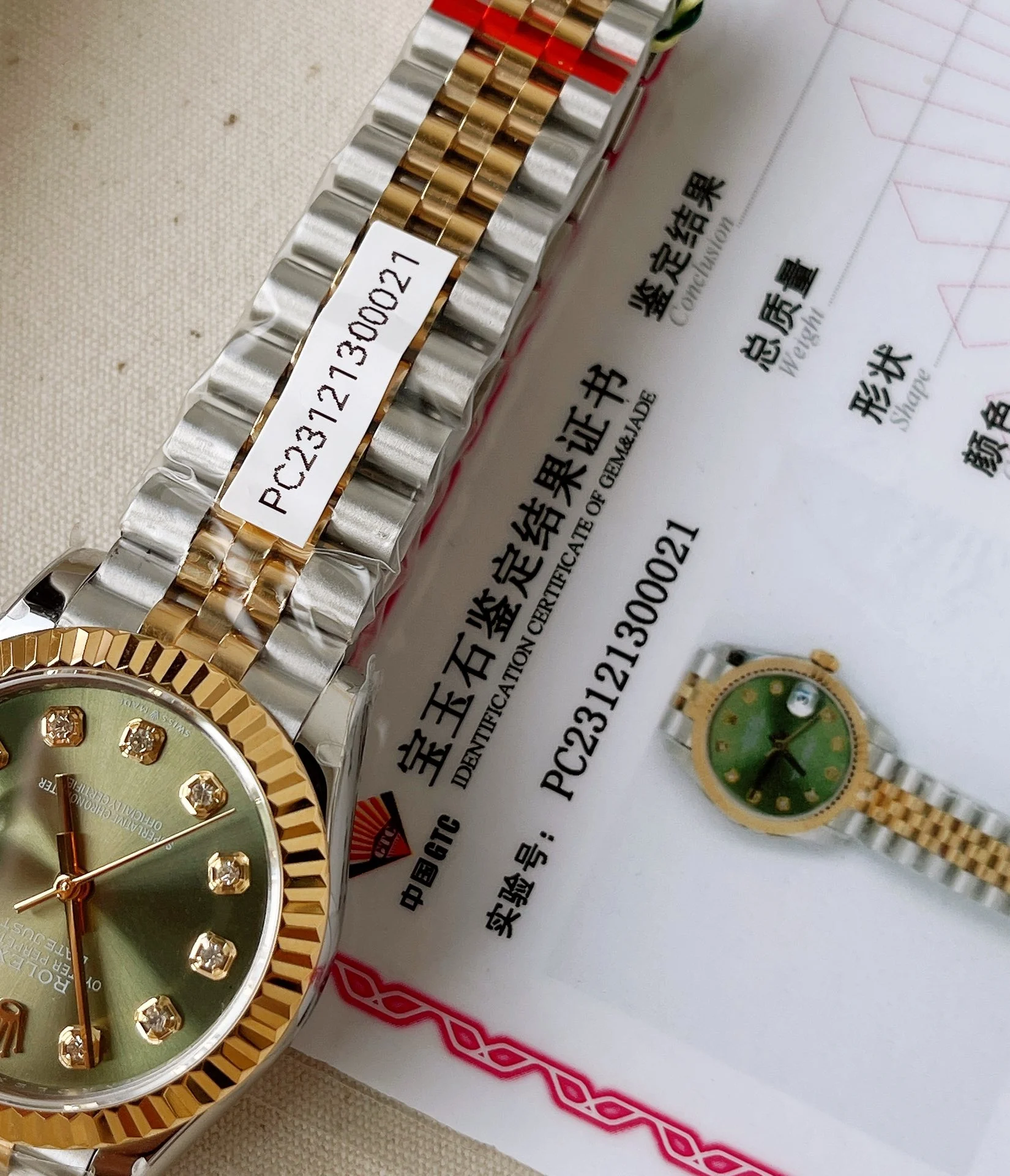 The dial is set with 10 VS-grade genuine diamonds , and each — photographed off the sweep