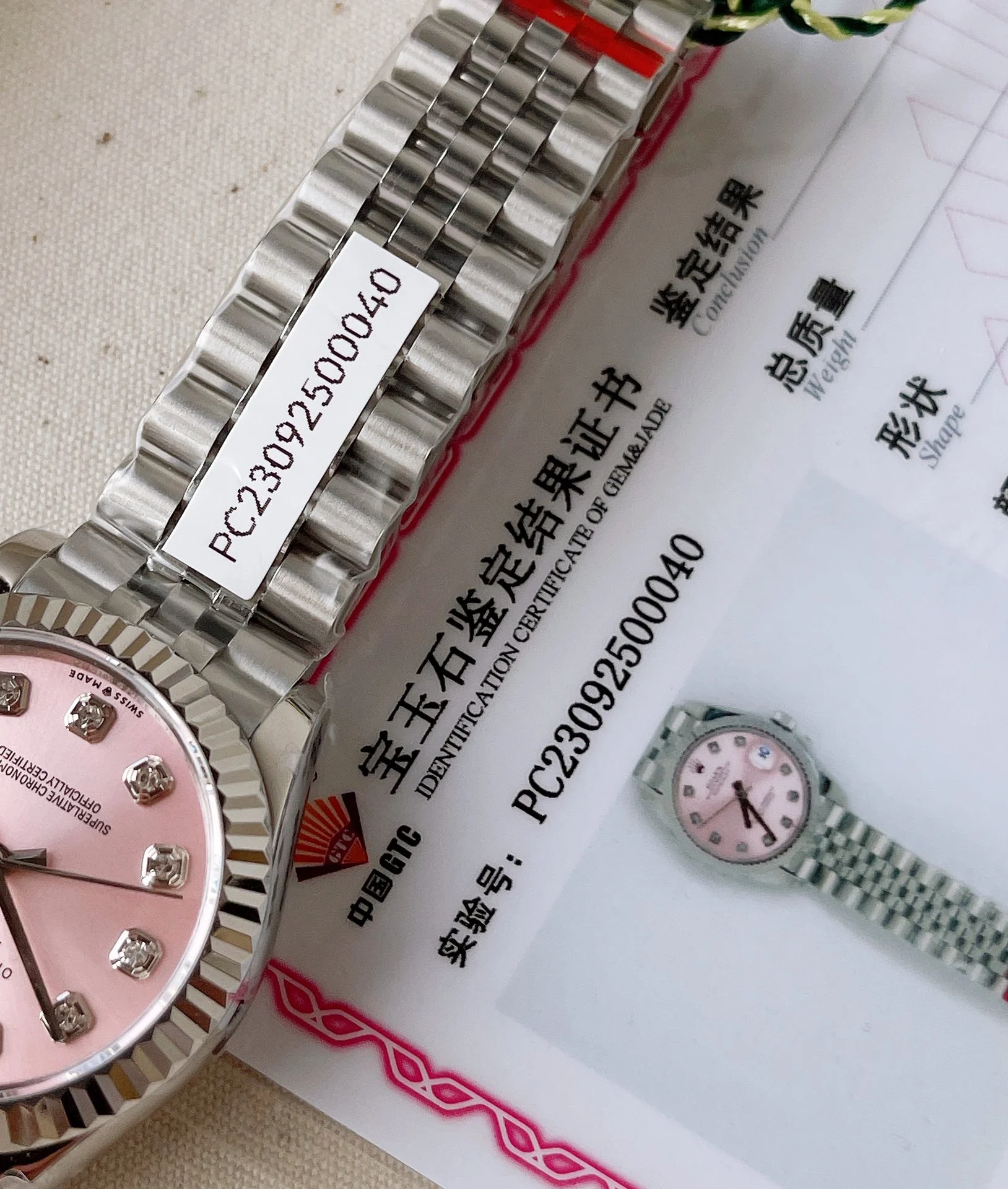 The dial is set with 10 VS-grade genuine diamonds , and each — photographed off the sweep