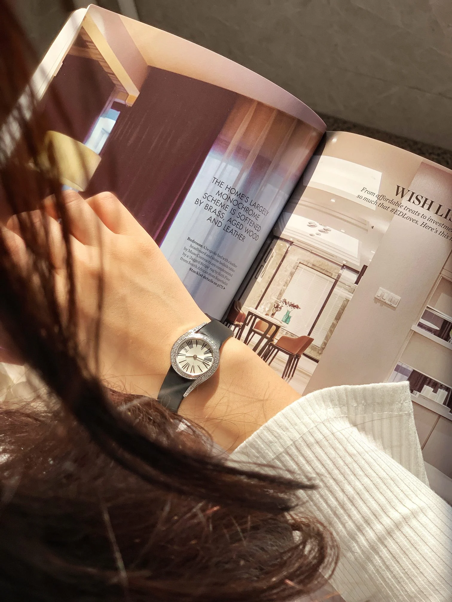 The elegant black Roman numeral hour markers, as seen in — photographed off the sweep