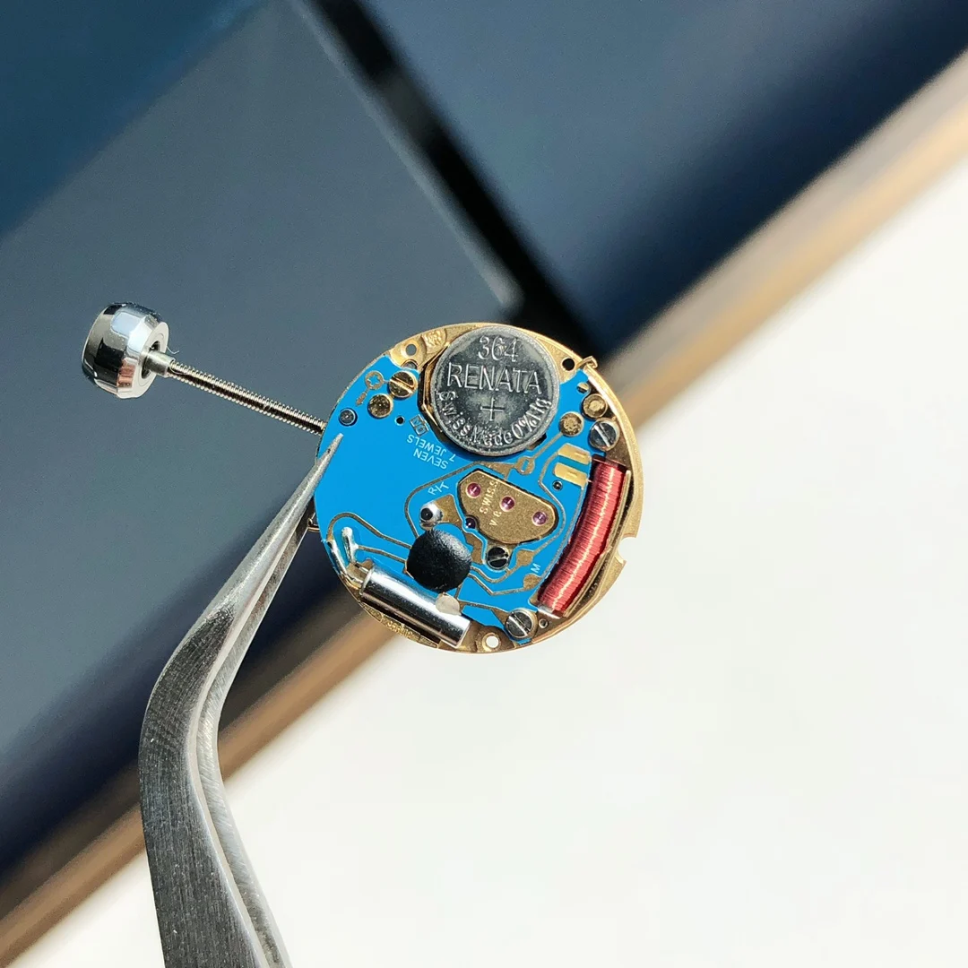 The movement uses genuine ETA-956.102 movement parts. Genuine — photographed off the sweep