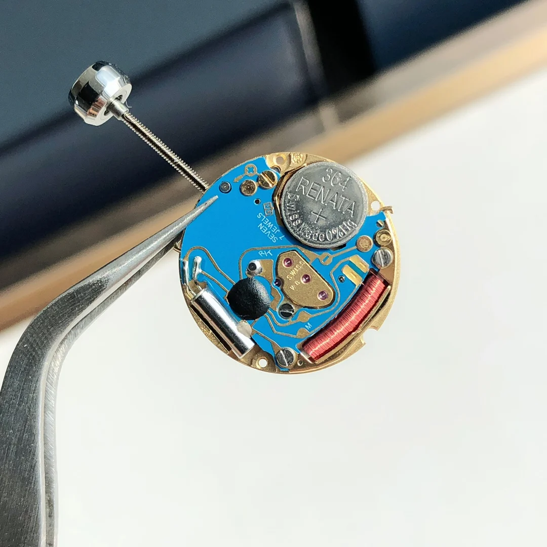 The movement uses genuine ETA-956.102 movement parts. Genuine — photographed off the sweep