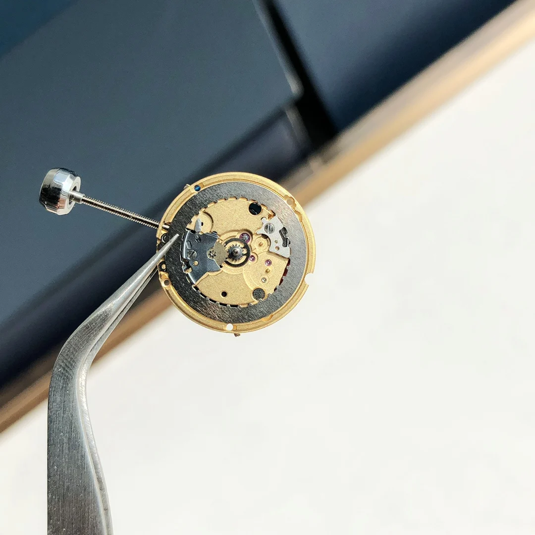 The movement uses genuine ETA-956.102 movement parts. Genuine — photographed off the sweep