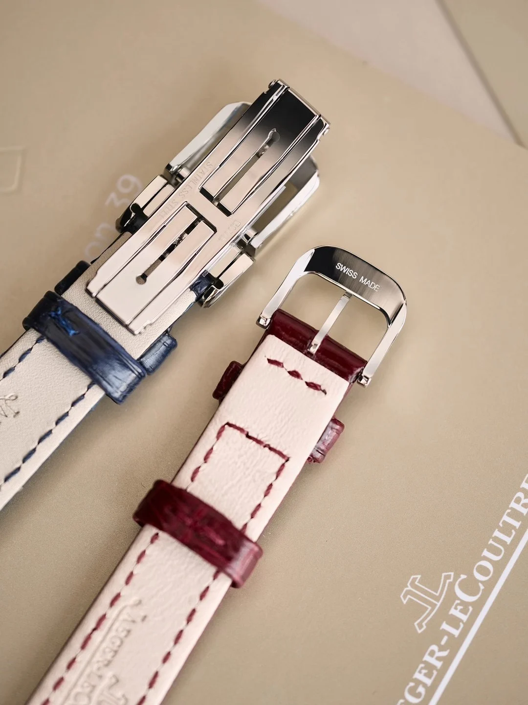 The red and white Claspé dials have different designs, but they — photographed off the sweep