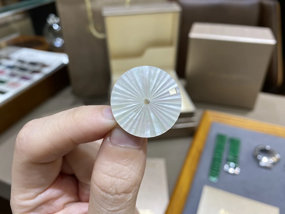 This rare Swiss mother-of-pearl dial features a sunburst pattern