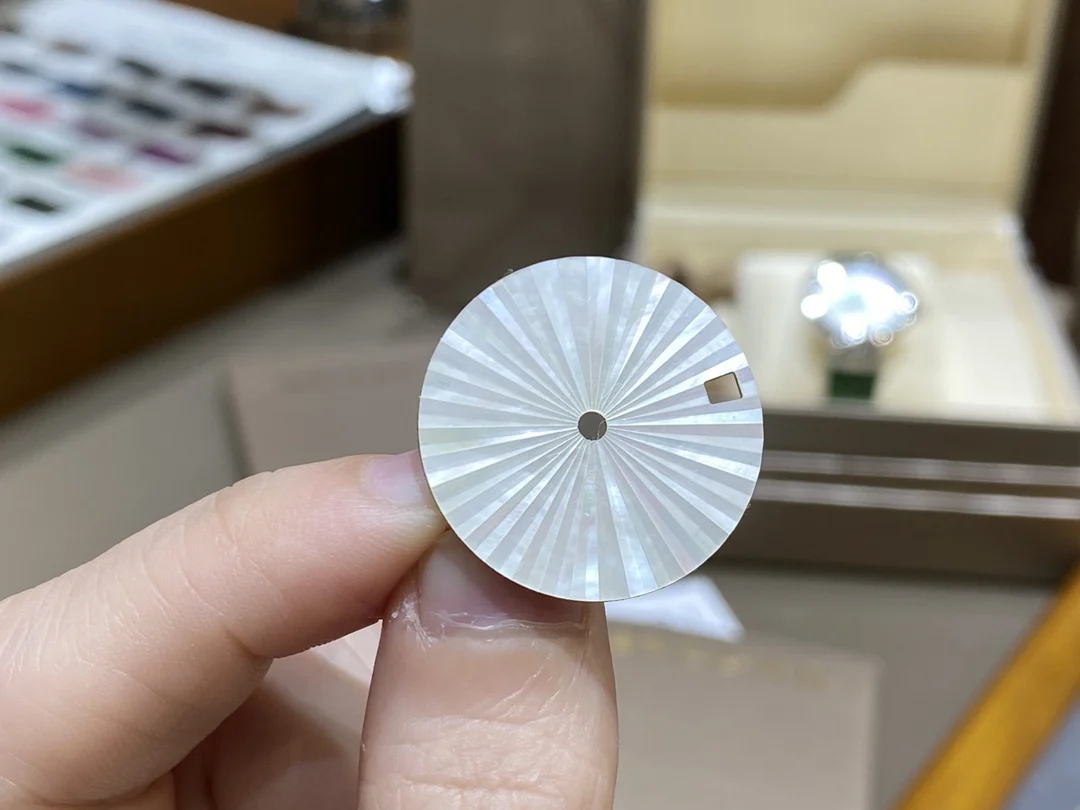 This rare Swiss mother-of-pearl dial features a sunburst pattern — photographed off the sweep