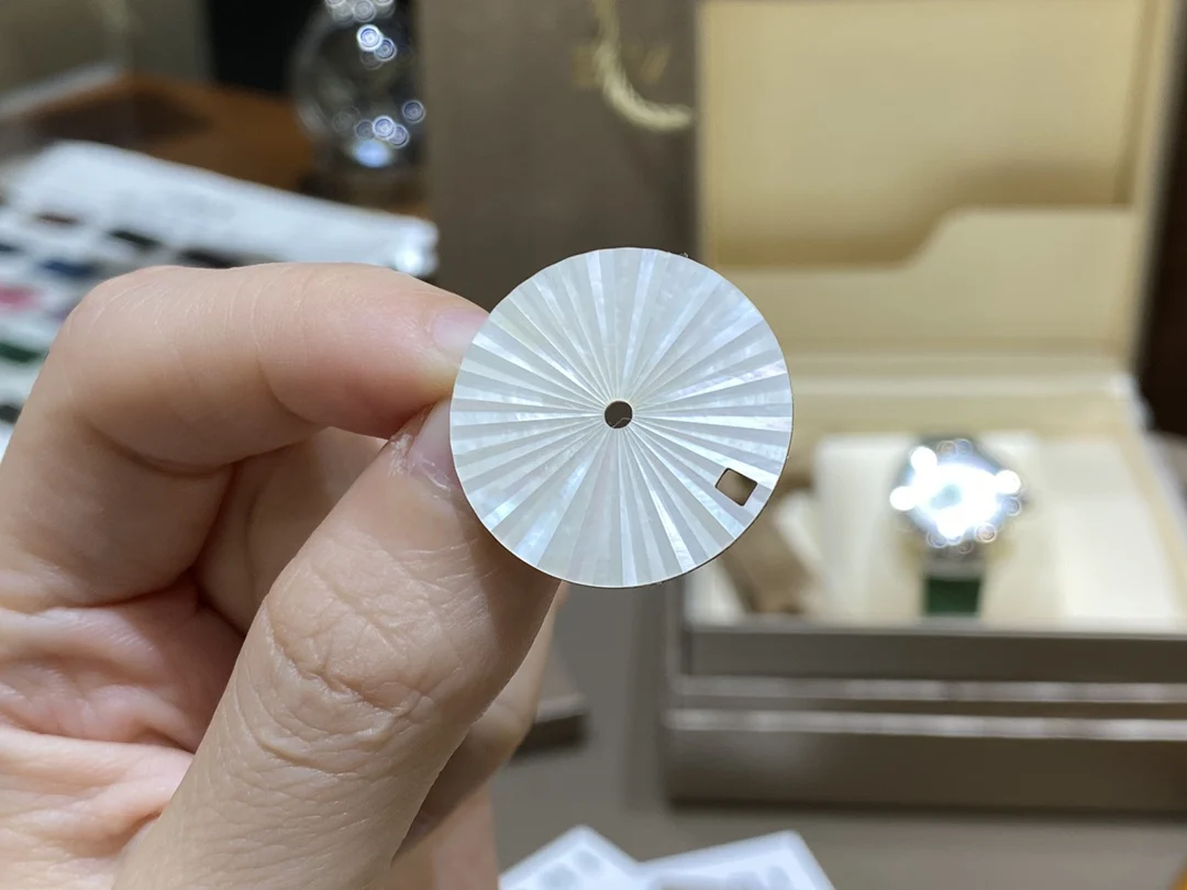 This rare Swiss mother-of-pearl dial features a sunburst pattern — photographed off the sweep