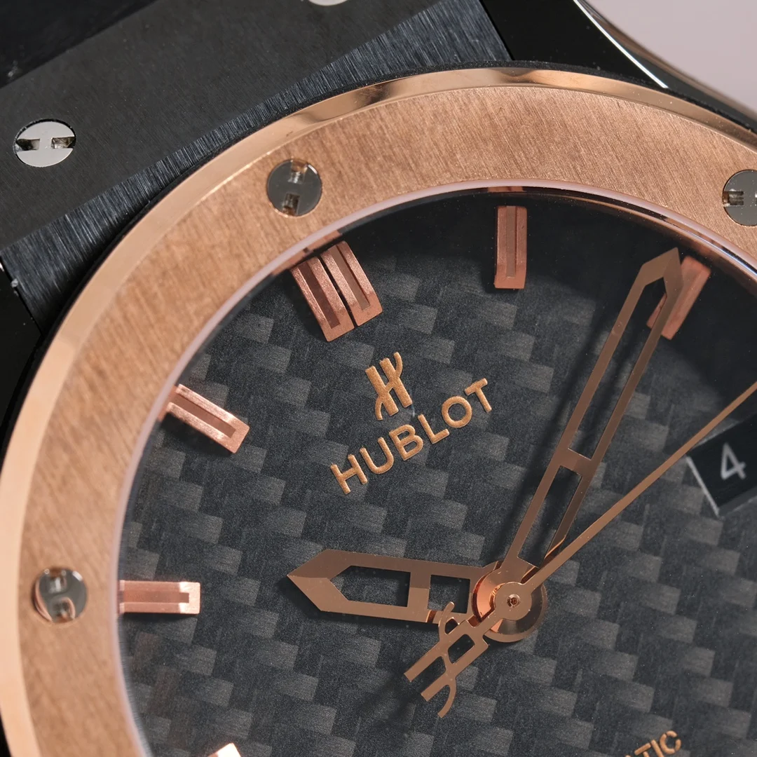 Two-tone steel and gold black carbon fiber — photographed off the sweep