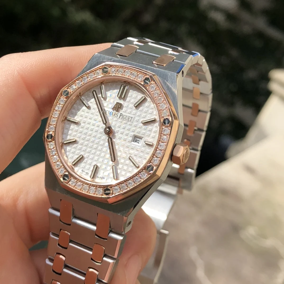 two-tone steel and gold white dial — photographed off the sweep