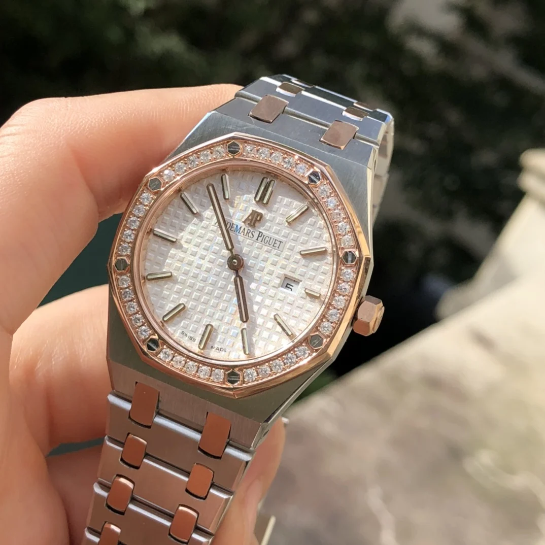 two-tone steel and gold white dial — photographed off the sweep
