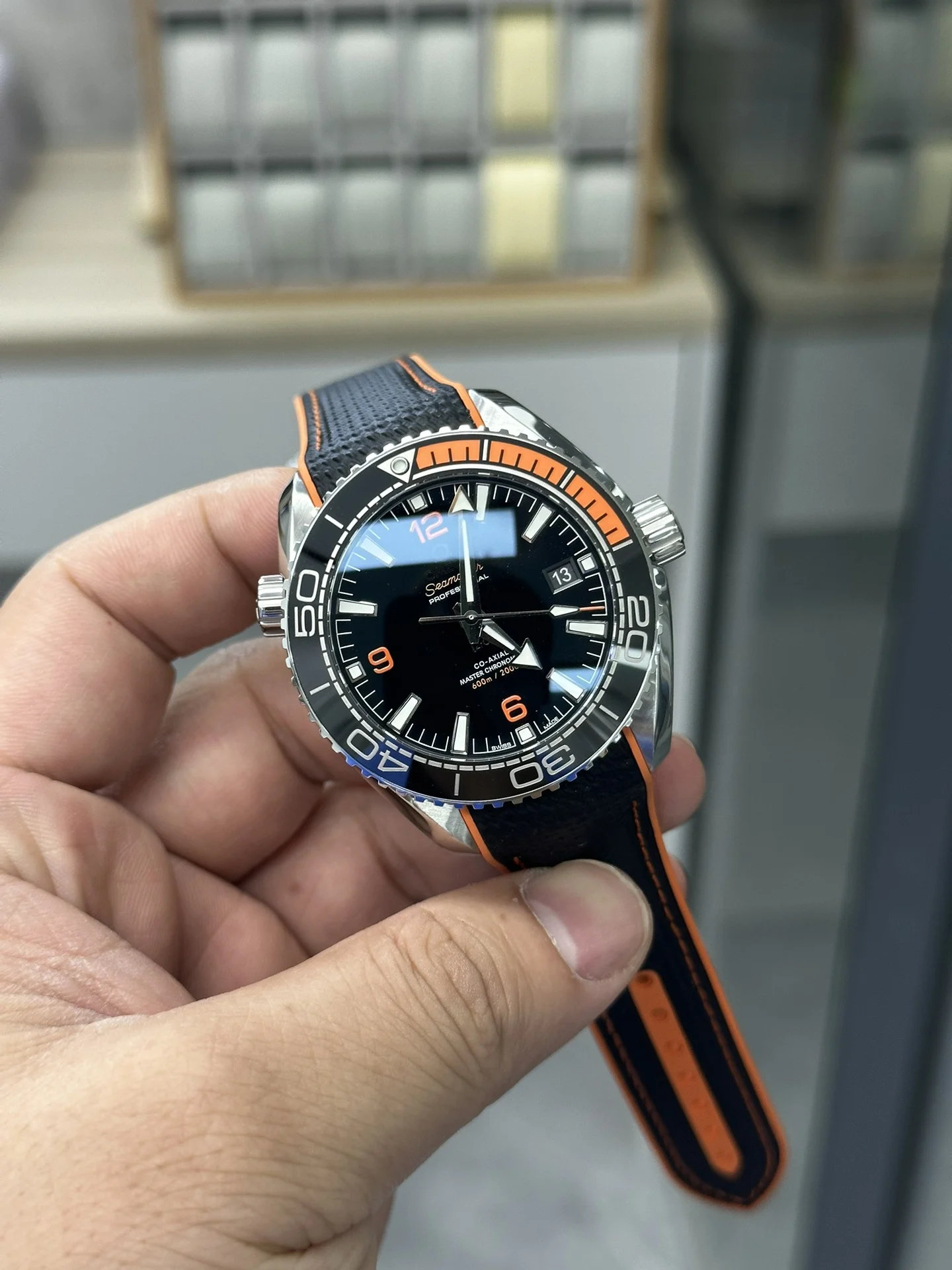 VS 41 Orange Rubber Strap 8900 Integrated Movement — photographed off the sweep